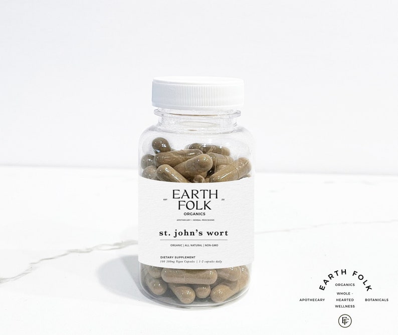 May include: A clear plastic bottle filled with brown capsules labeled "EARTH FOLK ORGANICS st. john's wort ORGANIC ALL NATURAL NON-GMO DIETARY SUPPLEMENT 100 500mg Vegan Capsules 1-2 capsules daily"