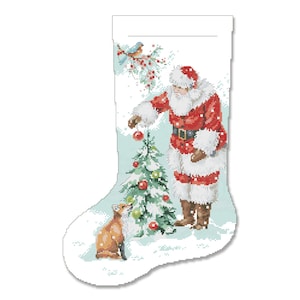 May include: A Christmas stocking with a Santa Claus figure decorating a small Christmas tree with a fox watching. The stocking is white with a blue background and the scene is set in a snowy winter wonderland.