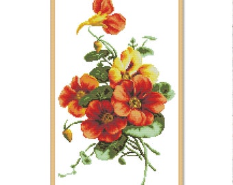 May include: A framed cross-stitch embroidery featuring a bouquet of red, orange, and yellow flowers with green leaves and stems on a white background.