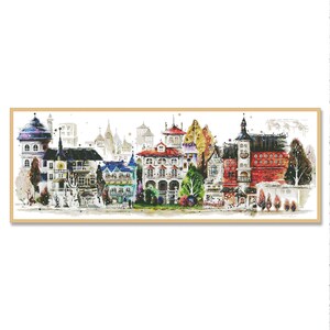 May include: A watercolor painting of a row of colorful houses with trees and a white background. The houses are in various styles and have different colored roofs. The trees are green and brown and have leaves. The background is white with a light blue sky.