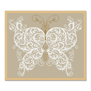 May include: A white butterfly with intricate, swirling patterns on a beige background. The butterfly is framed in a light brown frame.