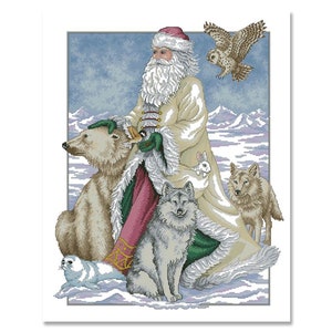 May include: Santa Claus in a white fur-trimmed coat with a red sash and green trim, standing in a snowy landscape with a polar bear, two wolves, a rabbit, and a seal.