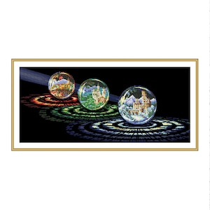 May include: Three glass spheres, each containing a different scene, are arranged on a black background. Each sphere is surrounded by a colourful ring.
