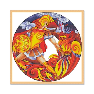 May include: Cross-stitch artwork in a round frame. The design features a warrior in yellow and red armour, holding a shield with a sun design, battling a red phoenix. The background is a mix of blue and white clouds.