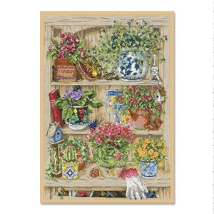 May include: A wooden shelf with a variety of potted plants, including a blue and white ceramic pot, a brown pot, and a green pot. There are also a few birdhouses and other decorative items on the shelf.