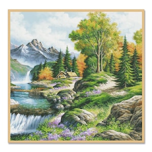 May include: A framed landscape painting showing a mountain scene with a waterfall, a small cabin, and a wooden bridge. The artwork features lush greenery, vibrant autumn foliage, and a clear blue sky. The painting is encased in a light brown wooden frame.