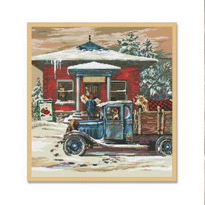 May include: A vintage blue truck with a wooden bed is parked in front of a red brick post office building. The truck is loaded with a Christmas tree and other packages. The building has a sign that reads "Post Office" and is decorated with snow and icicles.