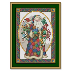 May include: A colorful cross-stitch pattern of Santa Claus holding a teddy bear and a bag of toys. The background is a white oval with a green, red, and blue border.