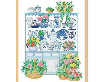 May include: A blue and white china cabinet with three shelves filled with teacups, teapots, and other decorative items. The cabinet is decorated with flowers and has a wooden frame.