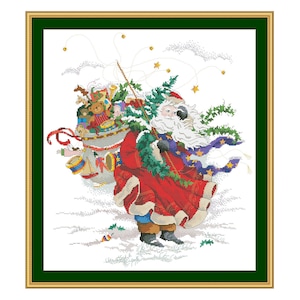 May include: Santa Claus carrying a large bag of toys, with a red and white suit, white beard, and a blue scarf with stars. He is walking through a snowy landscape with a green tree branch in his hand.