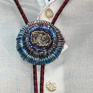 1.  Bolo tie.  Wire wrapping extraordinaire.