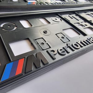 Juego de 2 soportes para matrícula M Performance para BMW UE