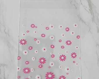 Clear cellophane self sealing bags with pink and white flower design, 10x7cm, pack of 10