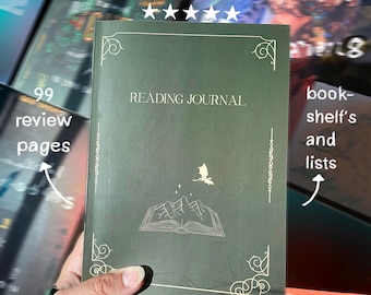 May include: A green reading journal with a gold dragon and open book design. The journal has the words "READING JOURNAL" printed on the front cover.