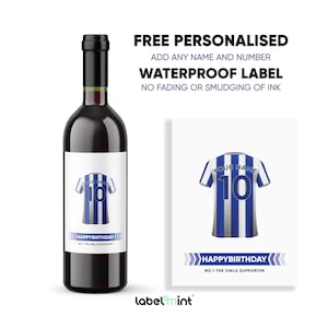 May include: A personalized wine bottle label with a blue and white striped soccer jersey design. The label says "Happy Birthday" and "No. 1 The Owls Supporter".