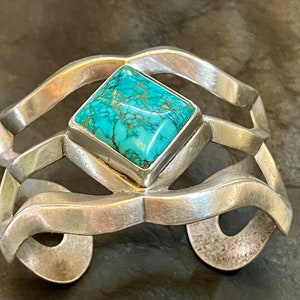 Navajo Sand Cast webbed turquoise and Sterling bracelet. Vintage 1950's. Size 6 1/2, including 1" gap. 1 1/8" diamond stone. Exc. condition.