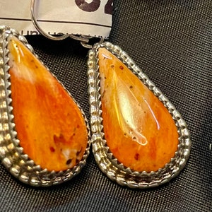 Navajo Spiny Oyster earrings; Sterling Silver, stamped; 1 3/8&quot; x 5/8&quot;.