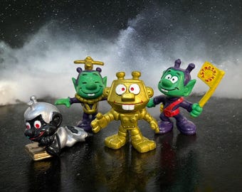 Lot of 4 Vintage Astrosniks from the 1983, Schaper. Bully. One is gold, another is black and two are green.