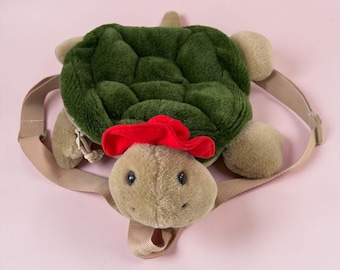 1995 Plush Backpack - Vintage Backpack plush Beige Turtle with red hat plush. Original Gurilla Biscuit brand. See photos and videos. No odor.