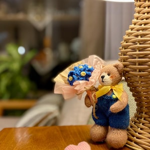 Hand-Knitted Teddy Bear with Blue Flower Bouquet – Romantic Gift for Her – Wool Yarn Plush Collectible Toy