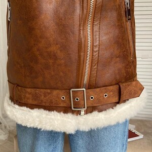 B3 bomber jacket women, RAF lambskin aviator coat, vintage brown shearling outerwear, real leather winter bomber, distressed flight jacket women, fur collar and cuff jacket, WWII pilot bomber coat, warm sheepskin flight jacket, retro aviator winter wear, classic fur-lined bomber, women’s brown leather coat, soft lambskin shearling jacket, stylish pilot bomber outerwear, handmade winter flight jacket, brown shearling coat for women, cozy RAF bomber jacket, women’s lambskin fur coat