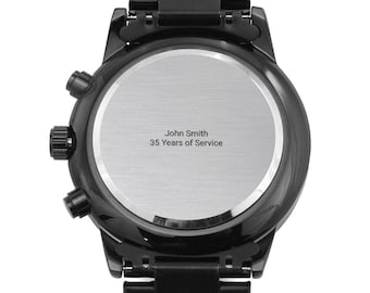 May include: A black metal wristwatch with a circular case and a matching link bracelet. The stainless steel case back features an engraving that reads John Smith 35 Years of Service in a clean, centred sans-serif font style.