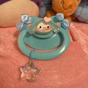 Adult Pacifier -Cinnamoroll Shaker with Star Charm- Blue and Pink Paci with Bows