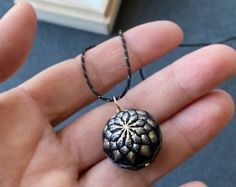 Japanese temari ball necklace "Kiku" with black and gold chrysanthemum flower. Traditional Japanese jewelry, silk embroidery, kumihimo cord.