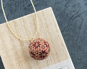 Japanese temari ball pendant "Hoshi" on kumihimo necklace. Geometric design with stars. Traditional Japanese silk and silver embroidery.