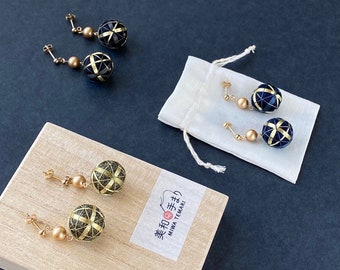 Japanese temari ball earrings with real silver and silk embroidery. Contemporary geometric pattern. Colors: black/navy/green.