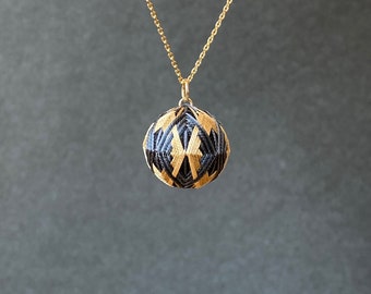 Japanese temari ball pendant "Hishigata" with geometric pattern, on chain necklace. Traditional Japanese jewelry, silk embroidery.