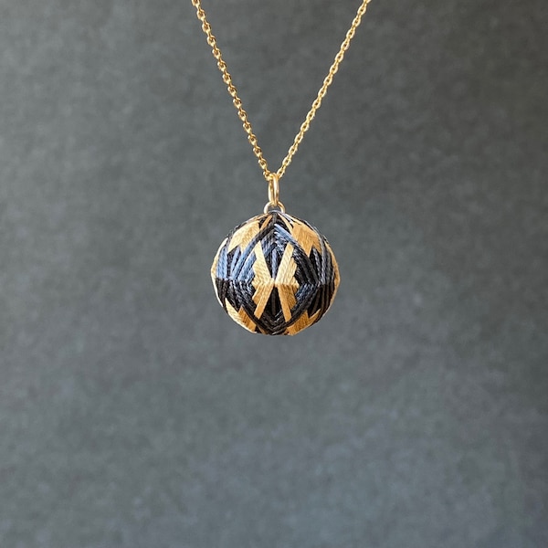 Japanese temari ball pendant "Hishigata" with geometric pattern, on chain necklace. Traditional Japanese jewelry, silk embroidery.