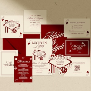 May include: A collection of wedding stationery with a Las Vegas theme. The design features a red and cream color scheme with playing card suits, dice, and the iconic Las Vegas sign. Includes invitations, RSVP cards, and details cards.