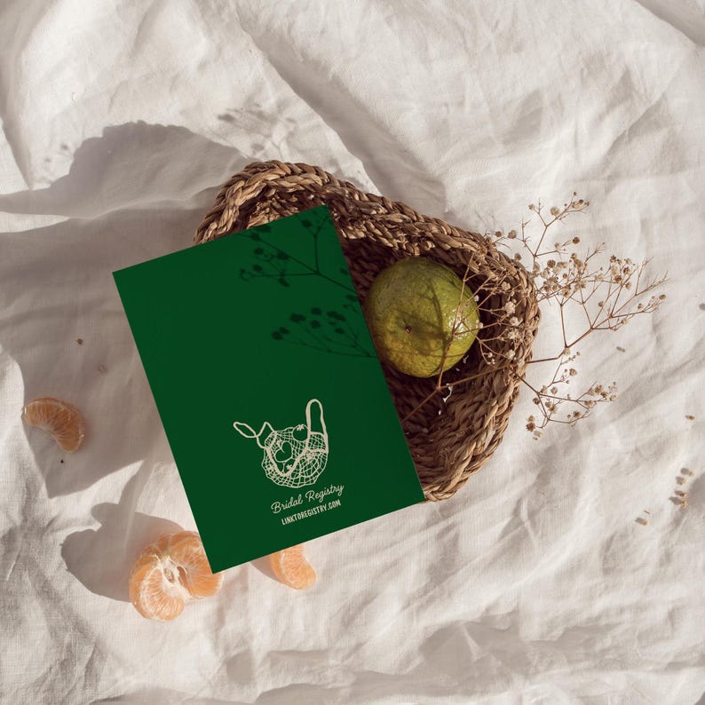 May include: A green card with a white outline of a mesh bag filled with fruit. The text "Bridal Registry" and "LINKTOBRIDALREGISTRY.COM" is printed on the card.