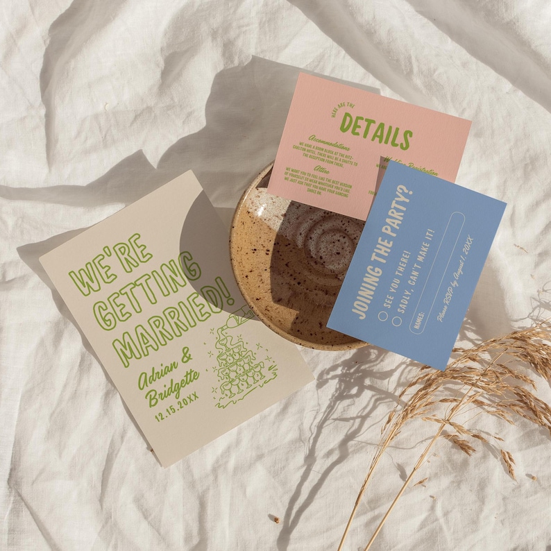 May include: A wedding invitation with a light brown background and green text. The text says "We're Getting Married!" with the couple's names, Adrian & Bridgette, and the date 12.15.20XX. A cartoon illustration of a wedding cake with fireworks is in the bottom right corner.