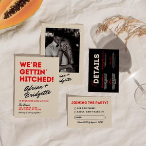 May include: A wedding invitation with a red and black color scheme. The invitation features a photo of the couple, the text "We're Gettin' Hitched!" and the names "Adrian + Bridgette". The invitation also includes the date and time of the wedding, the venue, and a RSVP card.