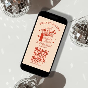 Op de afbeelding: Een smartphone met een crèmekleurige achtergrond toont een rode afbeelding met de tekst "Emily Found Her Perfect Match. Buy the Bride a Drink." en een QR-code. De tekst "Venmo @venmomande" staat onder de QR-code.