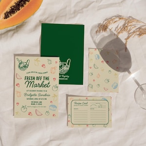 May include: A printable bridal shower invitation with a green background and a design of a mesh bag filled with produce. The text reads "Fresh Off The Market" and includes the bride-to-be's name, date, time, and location. A recipe card with a cream background and a design of produce is also included.