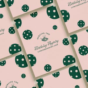 May include: Pink cards with a green polka dot pattern and the text "Serving the Birthday Registry linktoregistry.com".
