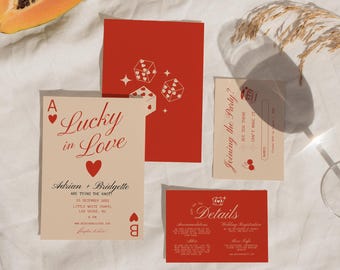 May include: A wedding invitation suite in a red and cream colour scheme. The main invitation features a playing card with the Ace of Hearts and the text "Lucky in Love". The invitation also includes the names Adrian and Bridgette, the date 15 December 20XX, the location Little White Chapel, Las Vegas, NV, and the time 6 PM. The RSVP card features the text "Joining the Party?" and has a space for the guest's name. The details card features the text "Details" and includes information about accommodation and wedding registration.