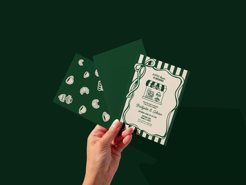 May include: Green and white invitation with the text "A little bean is brewing" and the names Bridgette & Adrian. The invitation has a striped border and a drawing of a coffee shop. Two additional green cards are also visible.