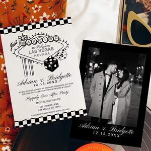 May include: Black and white wedding invitation with a Vegas theme. The invitation features a stylized illustration of the "Welcome to Fabulous Las Vegas" sign with dice and the text "Just Married". The invitation also includes the couple's names, wedding date, and details about the reception. A black and white photo of the couple is included on the right side of the invitation.