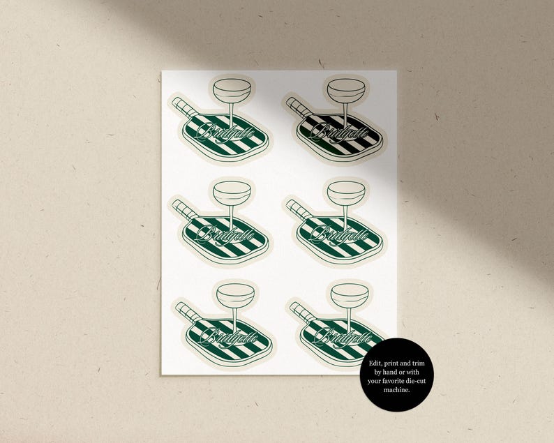 May include: Sheet of stickers featuring a paddle with a wine glass and the word "Bridgelle" in a script font. The paddle has green and white stripes. The stickers are on a white background. Text on the image says "Edit, print and trim by hand or with your favorite die-cut machine."