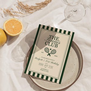 May include: An invitation for "The Tennis Club" with a green and white striped border, featuring tennis rackets and a ball. The invitation is on a plate with a glass of water and a lemon. The text reads "Bridgette's 21st Birthday".