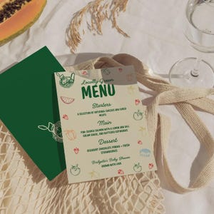 May include: A menu card with the text "Locally Grown MENU" in green and white. The menu lists starters, main course, and dessert options. The menu is for Bridgette's Baby Shower.