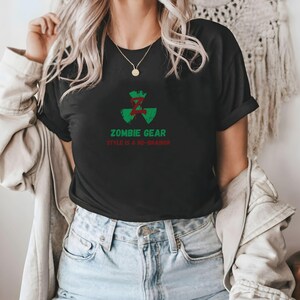 May include: Black t-shirt with a green and red zombie symbol and the text "Zombie Gear Style is a no-brainer".
