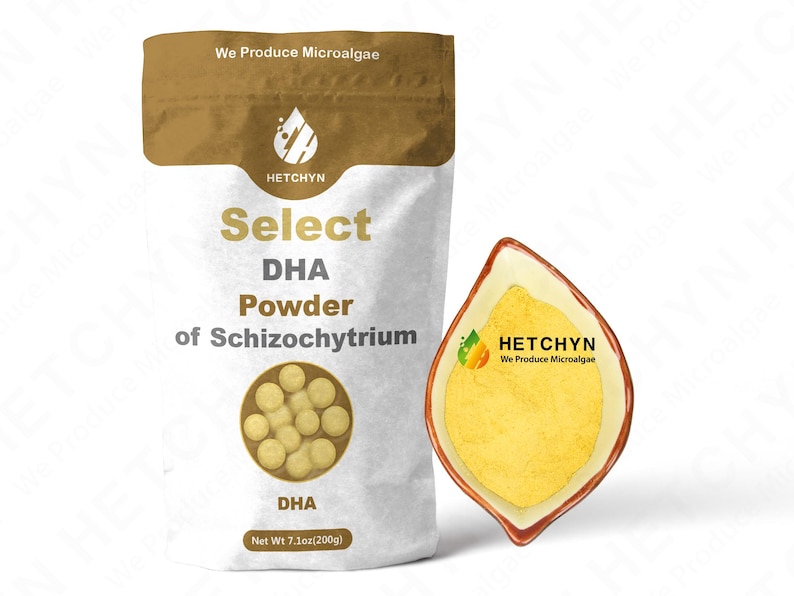 May include: A white bag of Select DHA Powder of Schizochytrium with a brown top, and a leaf-shaped dish filled with yellow powder. The bag has the text "HETCHYN We Produce Microalgae" and "Net Wt 7.1oz(200g)".