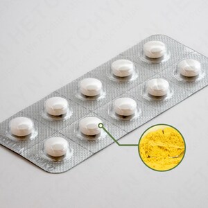 May include: A blister pack of white pills with a close-up of yellow powder. The pills are round and in a silver foil package. The yellow powder is in a circular inset.