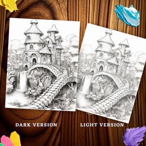 May include: Two grayscale coloring pages featuring a fantasy castle scene with a waterfall and bridge. The pages are labeled "DARK VERSION" and "LIGHT VERSION". The image is on a wooden background with paint splotches.