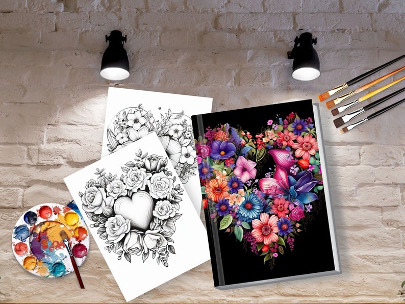 K&ouml;nnte beinhalten: Zwei Schwarzwei&szlig;-Malvorlagen mit floralen Herzmotiven. Eine dritte Seite zeigt ein farbenfrohes florales Herzmotiv auf schwarzem Hintergrund. Eine Farbpalette und Pinsel sind ebenfalls im Bild enthalten.